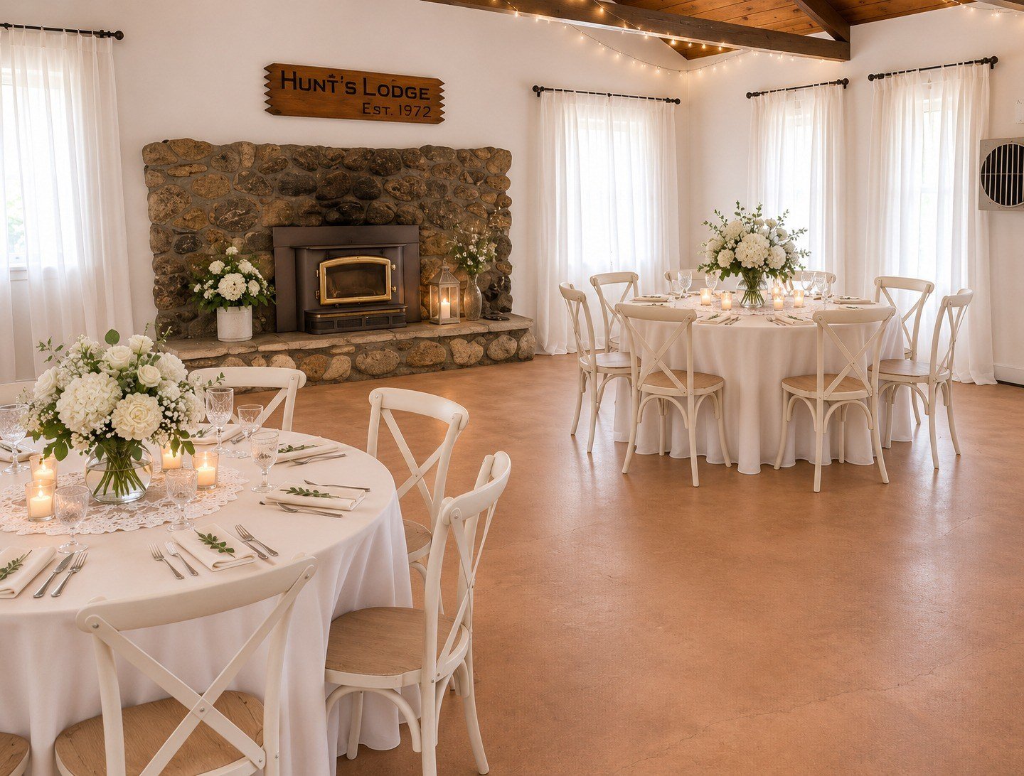 Indoor celebration setup inspiration beside the lodge's stone fireplace